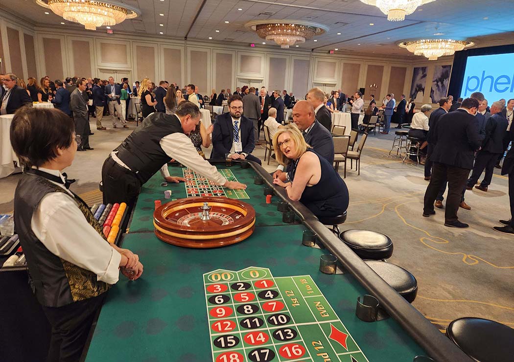 Double Roulette table with two dealers and players