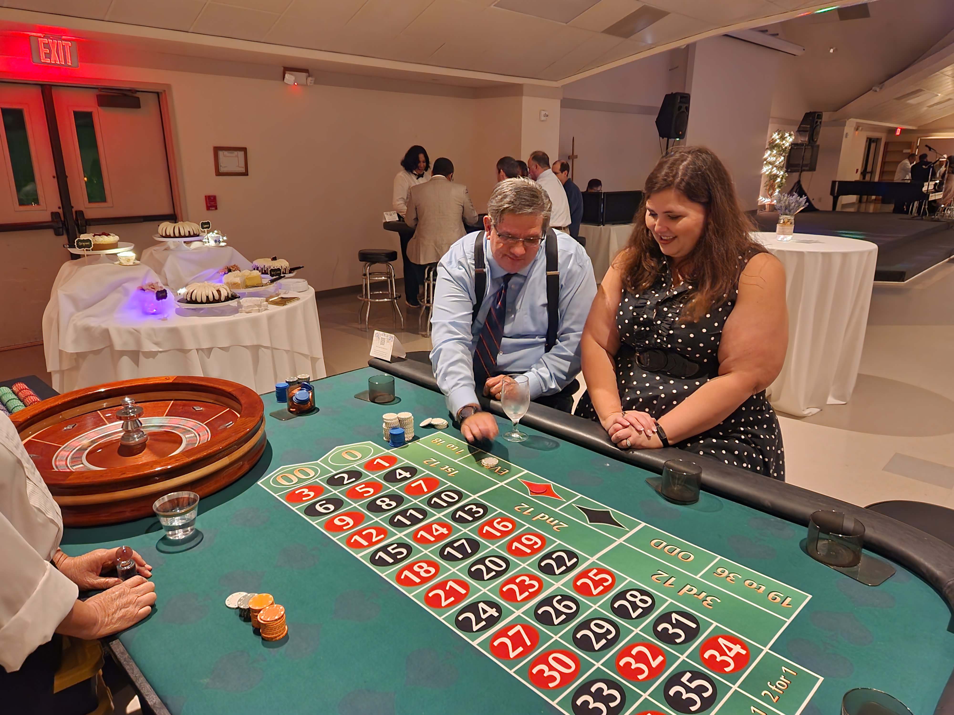 Roulette table with players and dealers at a Fundraiser.